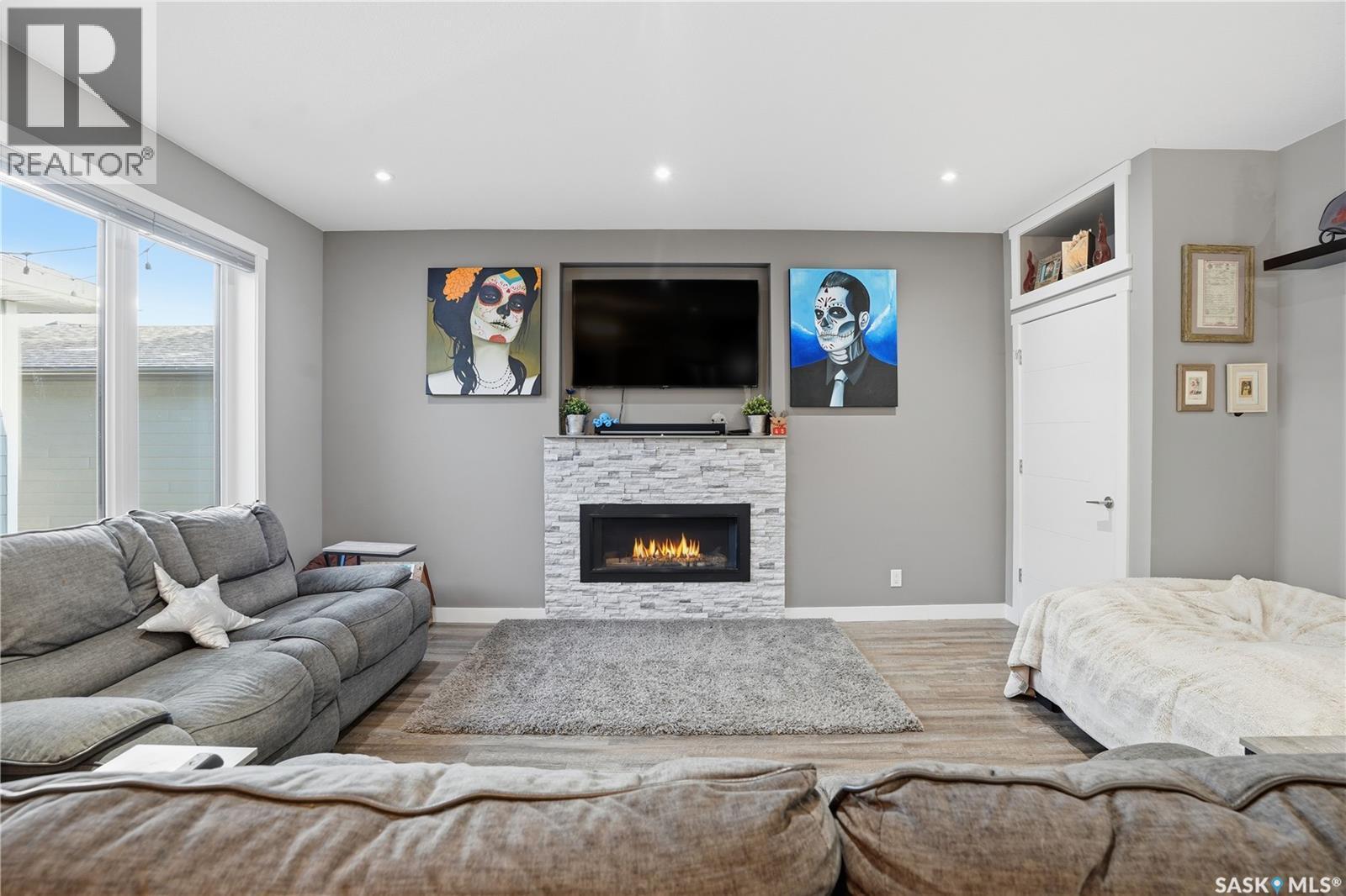 4202 Green Olive Way E, Regina, SK - Indoor Photo Showing Living Room With Fireplace