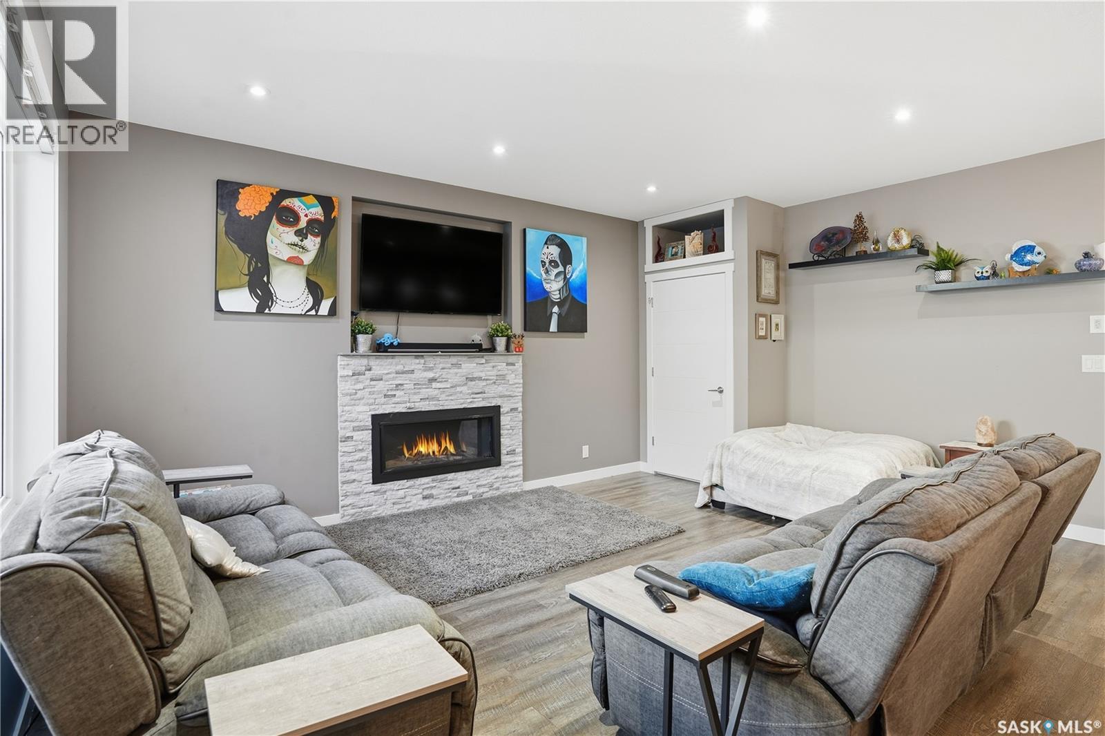 4202 Green Olive Way E, Regina, SK - Indoor Photo Showing Living Room With Fireplace