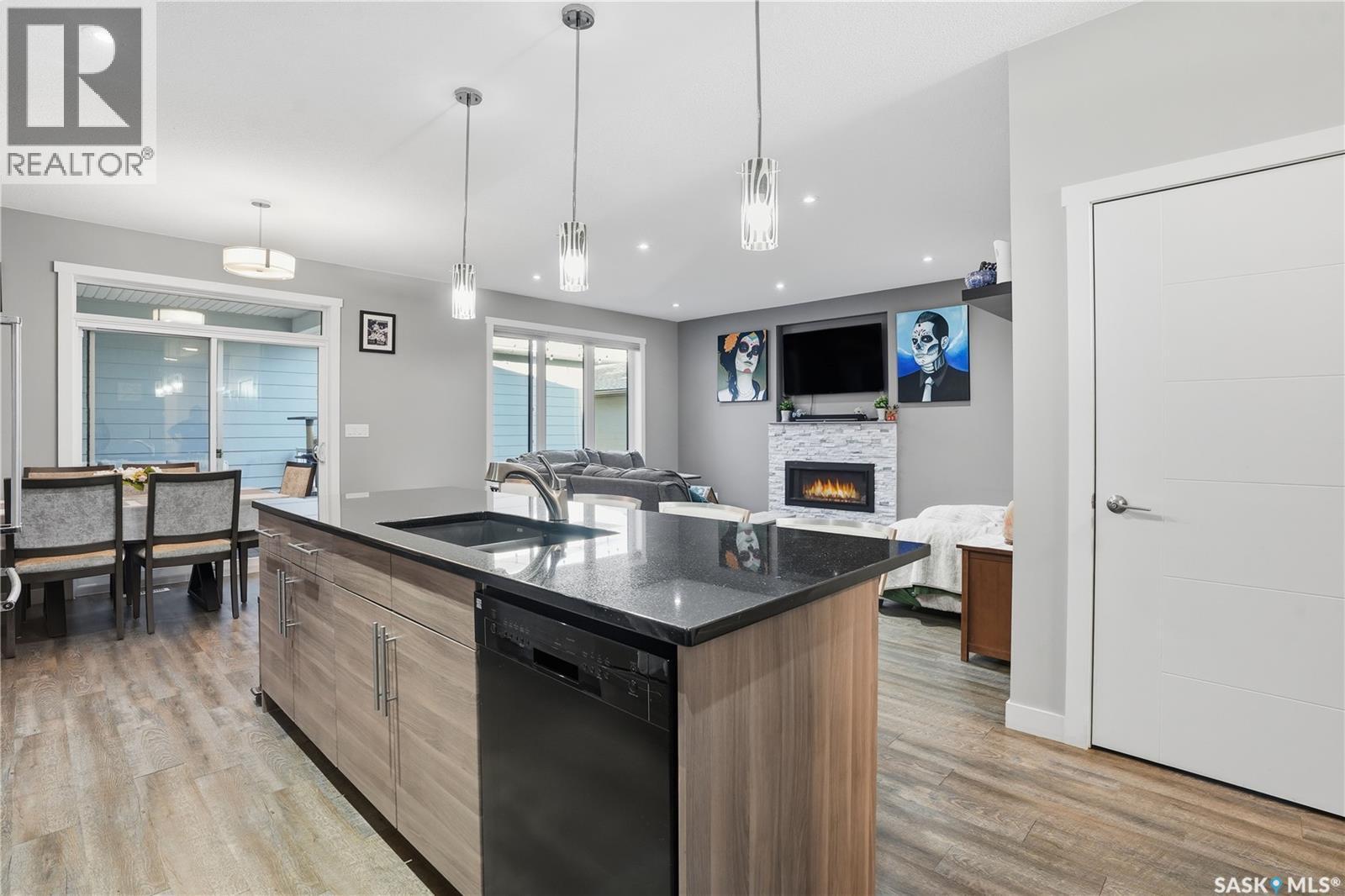 4202 Green Olive Way E, Regina, SK - Indoor Photo Showing Kitchen With Fireplace