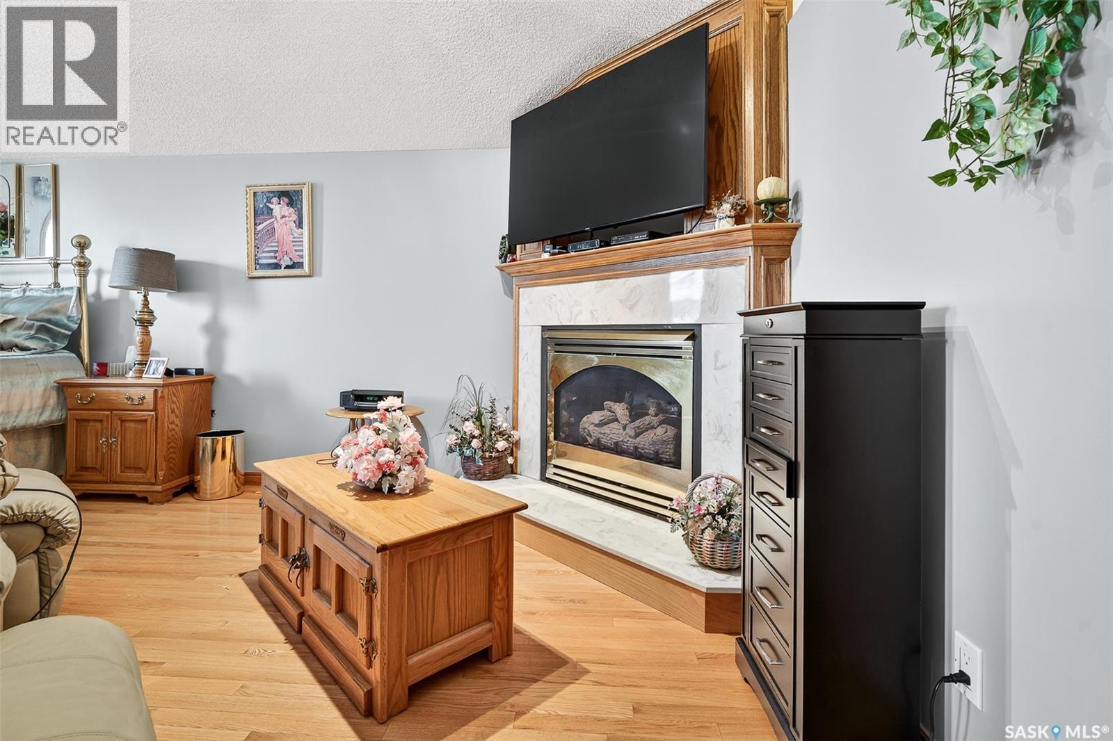 80 Bluebell Crescent, Moose Jaw, SK - Indoor Photo Showing Living Room With Fireplace