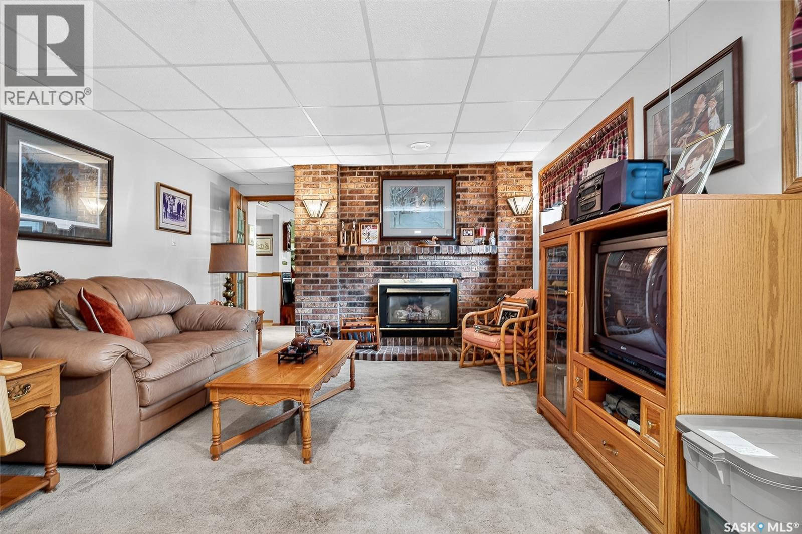 80 Bluebell Crescent, Moose Jaw, SK - Indoor Photo Showing Living Room With Fireplace