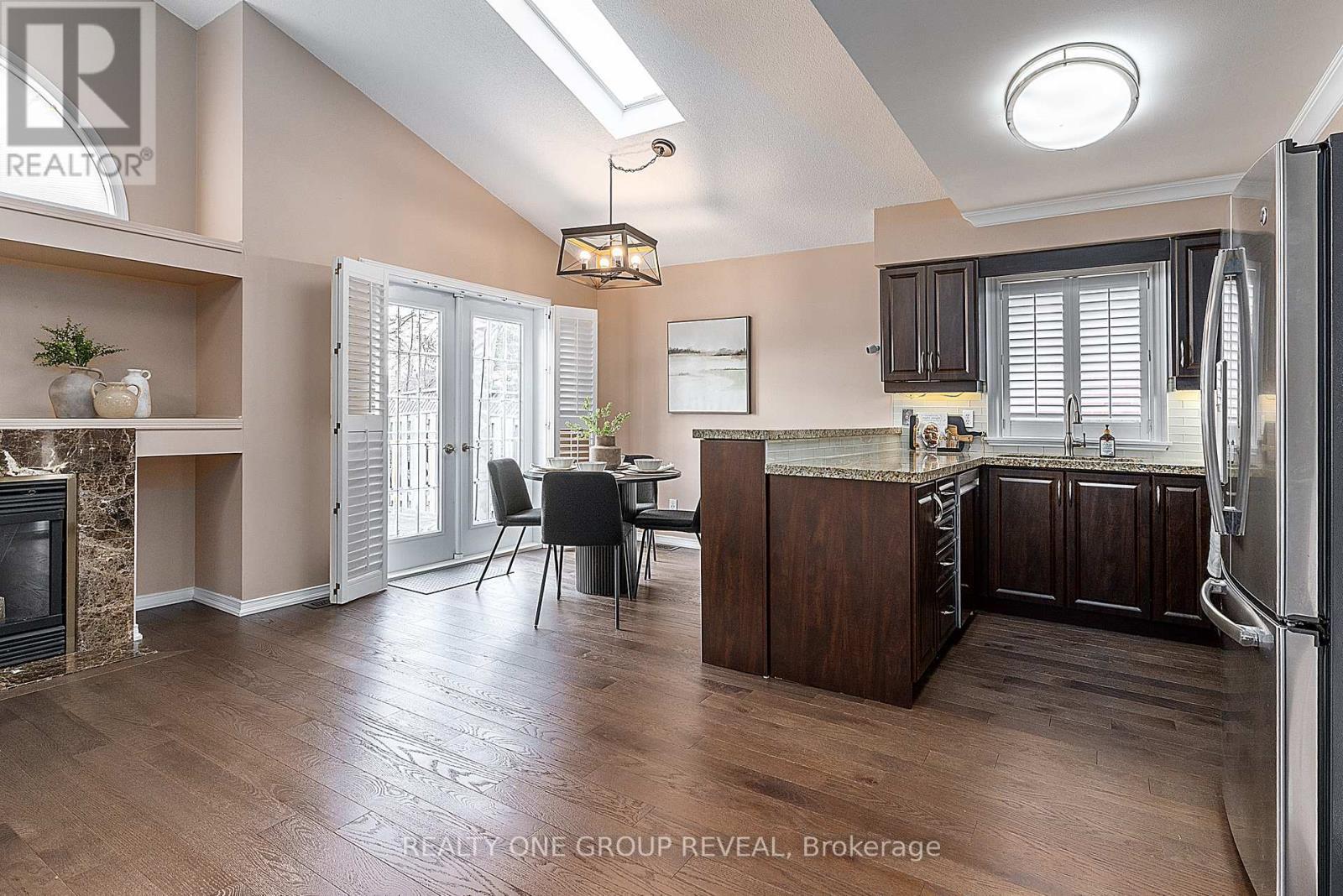37 Wetherburn Drive, Whitby, ON - Indoor Photo Showing Kitchen With Fireplace
