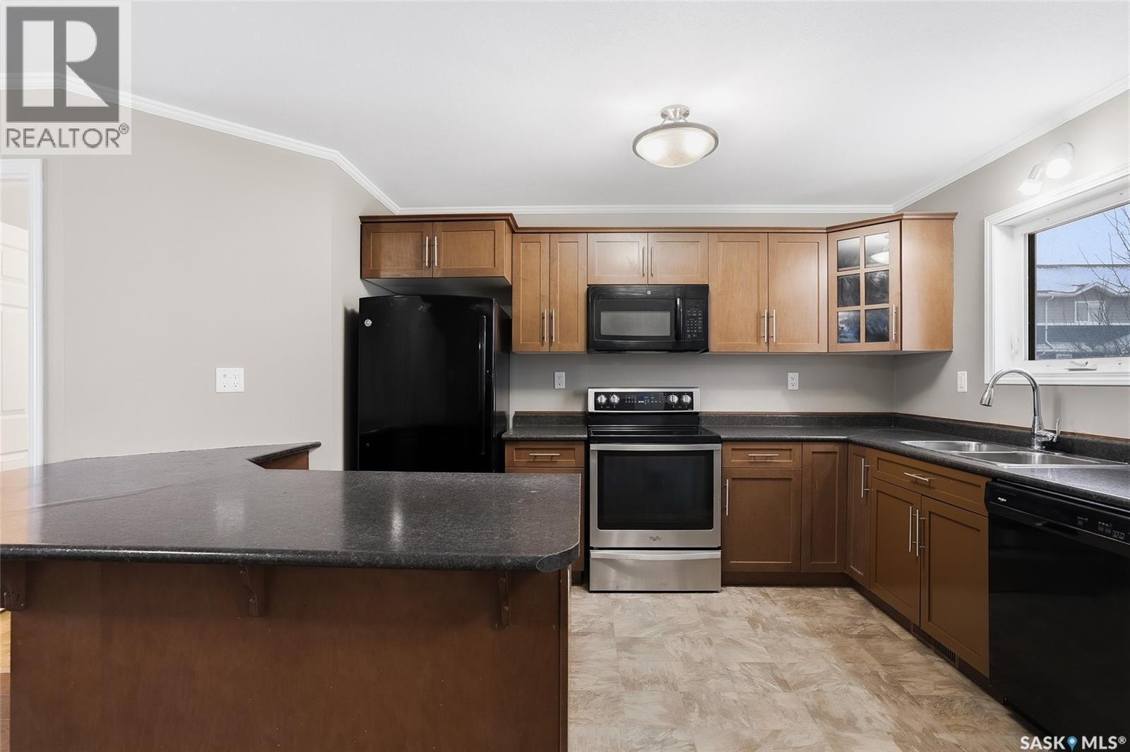 210 275 Pringle Lane, Saskatoon, SK - Indoor Photo Showing Kitchen With Double Sink