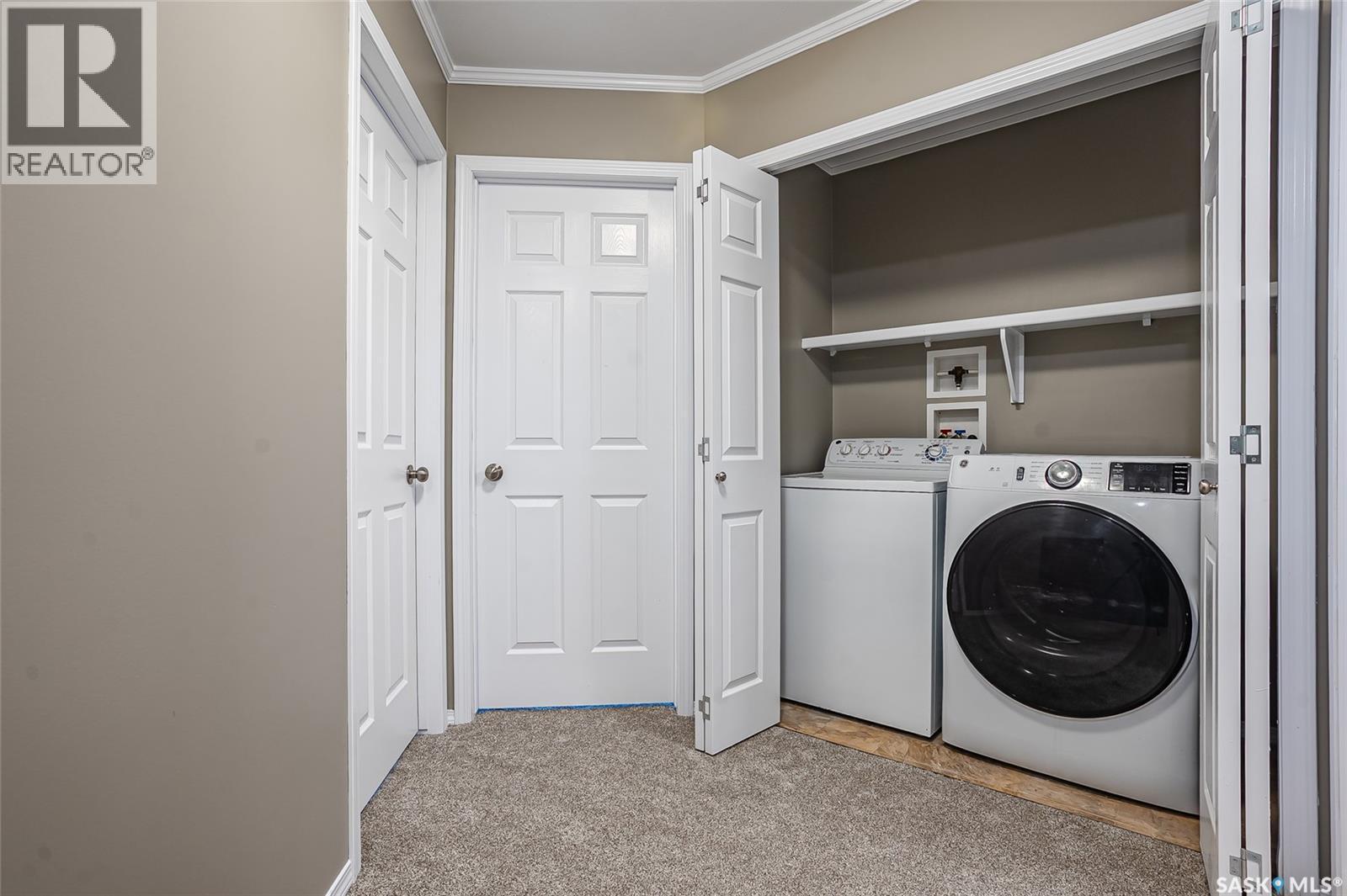 210 275 Pringle Lane, Saskatoon, SK - Indoor Photo Showing Laundry Room