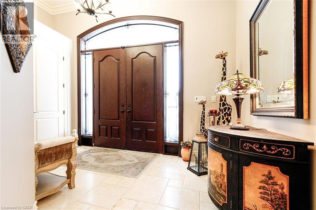 Foyer featuring healthy amount of natural light and ornamental molding - 205 Paige Place, Kitchener, ON - Indoor Photo Showing Other Room