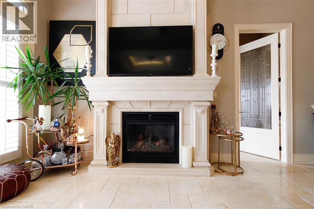 Detailed view of a high end fireplace - 205 Paige Place, Kitchener, ON - Indoor Photo Showing Living Room With Fireplace