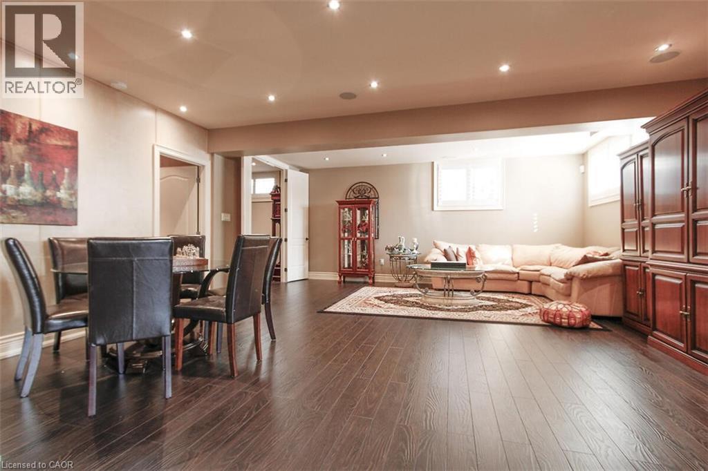 Living room featuring recessed lighting and dark wood-type flooring - 205 Paige Place, Kitchener, ON - Indoor