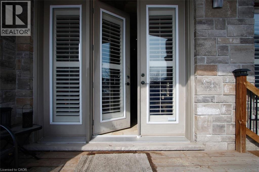 Doorway to property with stone siding - 205 Paige Place, Kitchener, ON - Outdoor
