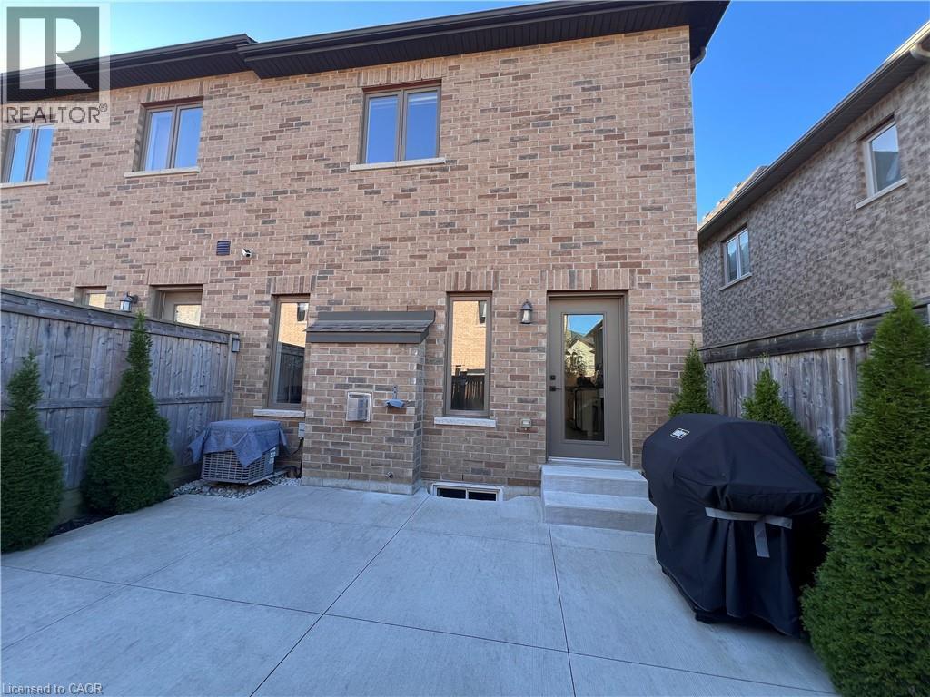 Rear view of house with brick siding and a patio - 1165 West 5Th Street, Hamilton, ON - Outdoor With Deck Patio Veranda With Exterior