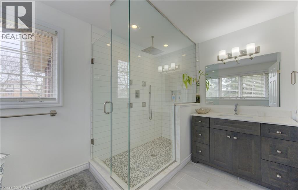 Full bathroom with vanity, a stall shower, light tile patterned floors, and recessed lighting - 306 Roxton Drive, Waterloo, ON - Indoor Photo Showing Bathroom