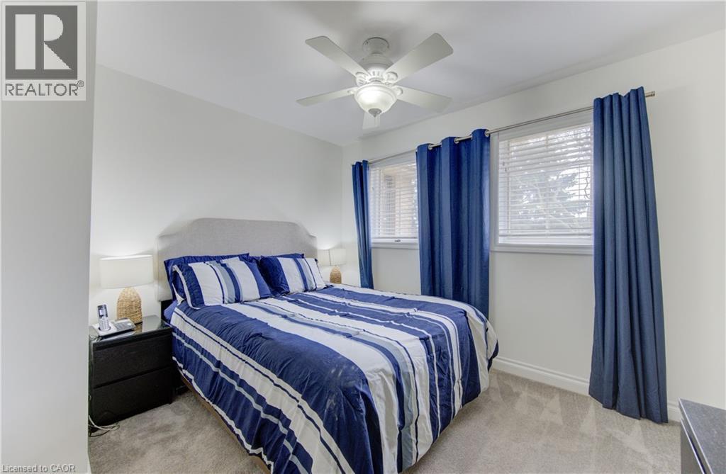 Bedroom featuring light colored carpet and ceiling fan - 306 Roxton Drive, Waterloo, ON - Indoor Photo Showing Bedroom