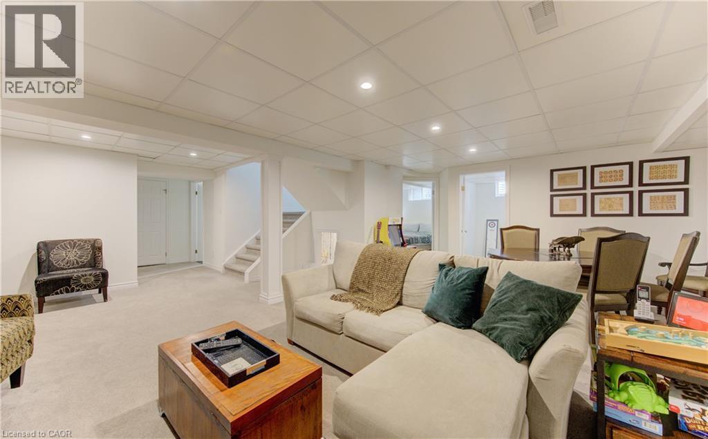 Living room with a paneled ceiling, recessed lighting, and light colored carpet - 306 Roxton Drive, Waterloo, ON - Indoor