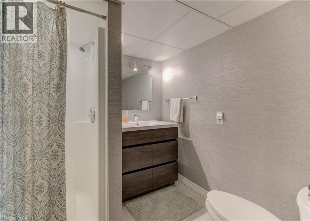 Full bathroom featuring a stall shower, vanity, and light tile patterned floors - 306 Roxton Drive, Waterloo, ON - Indoor Photo Showing Bathroom