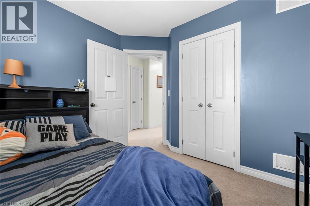 Bedroom featuring light colored carpet and a closet - 160 Wallace Avenue S, Welland, ON - Indoor Photo Showing Bedroom
