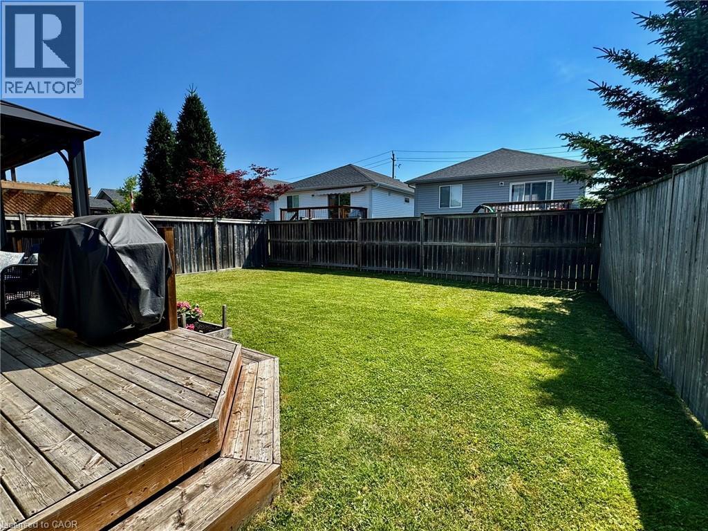 Fenced backyard featuring a deck - 160 Wallace Avenue S, Welland, ON - Outdoor With Deck Patio Veranda