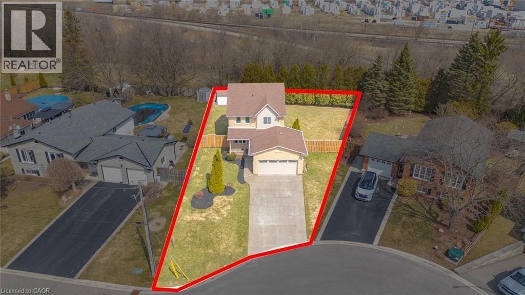 Aerial view of residential area featuring property parcel outlined - 200 Morrison Drive, Caledonia, ON -