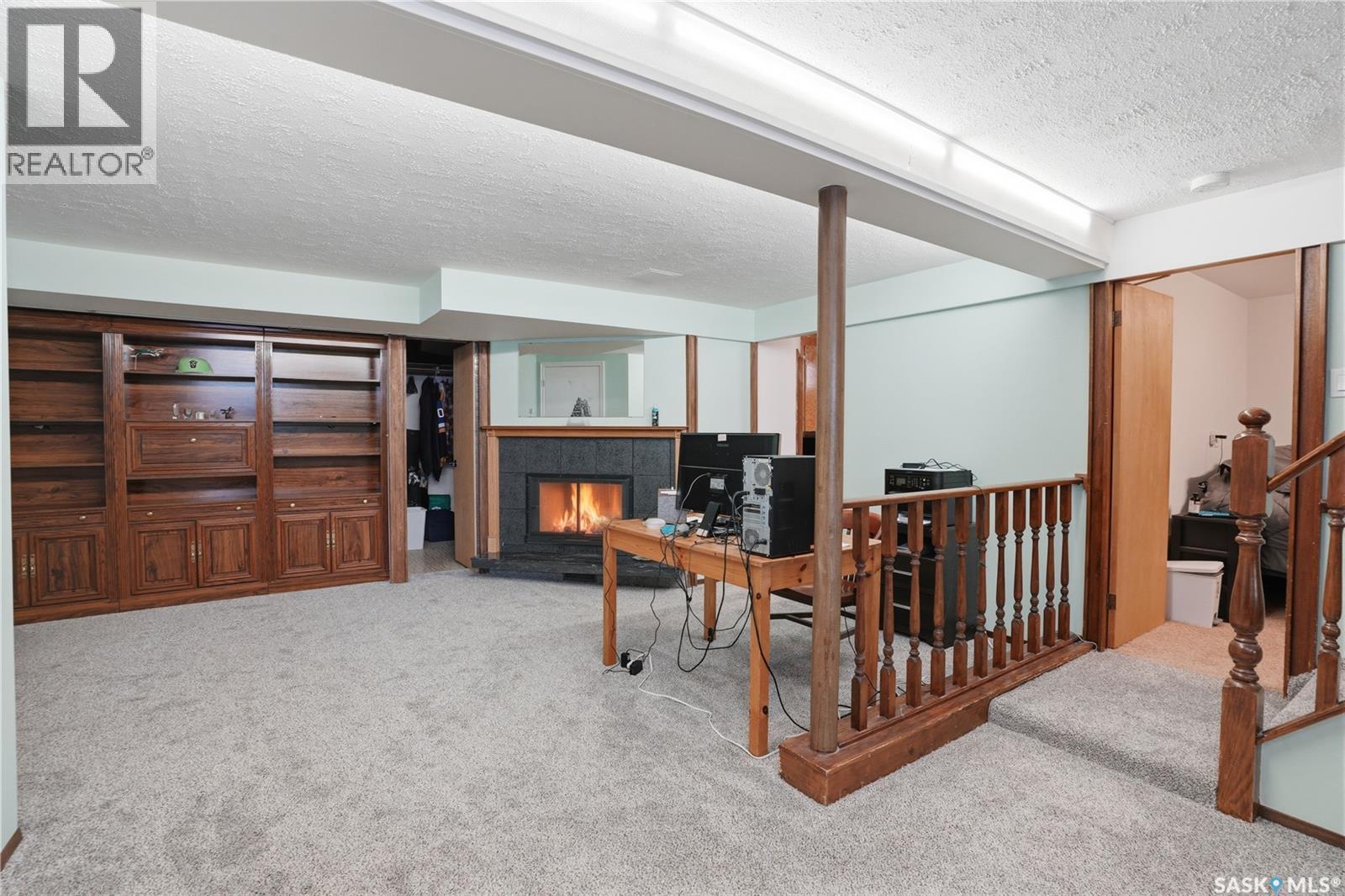 1011 Taylor Street E, Saskatoon, SK - Indoor Photo Showing Other Room With Fireplace