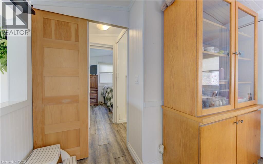 Hallway with light wood-style floors and crown molding - 580 Beaver Creek Road Unit# 11, Waterloo, ON - Indoor Photo Showing Other Room