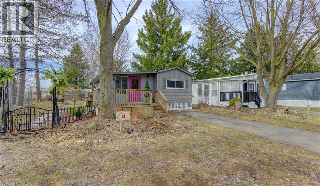 Manufactured / mobile home with asphalt driveway - 580 Beaver Creek Road Unit# 11, Waterloo, ON - Outdoor