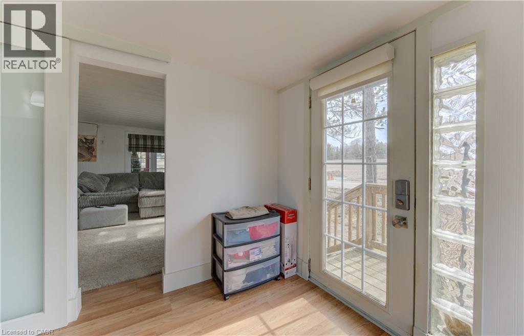 Doorway to outside with wood finished floors and french doors - 580 Beaver Creek Road Unit# 11, Waterloo, ON - Indoor Photo Showing Other Room