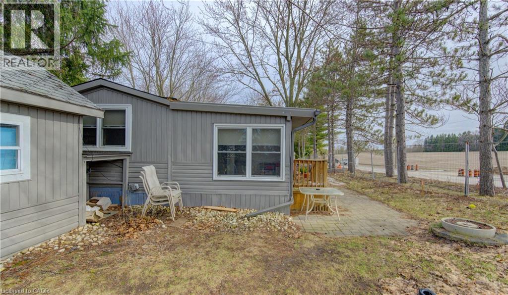 View of side of property with a deck - 580 Beaver Creek Road Unit# 11, Waterloo, ON - Outdoor
