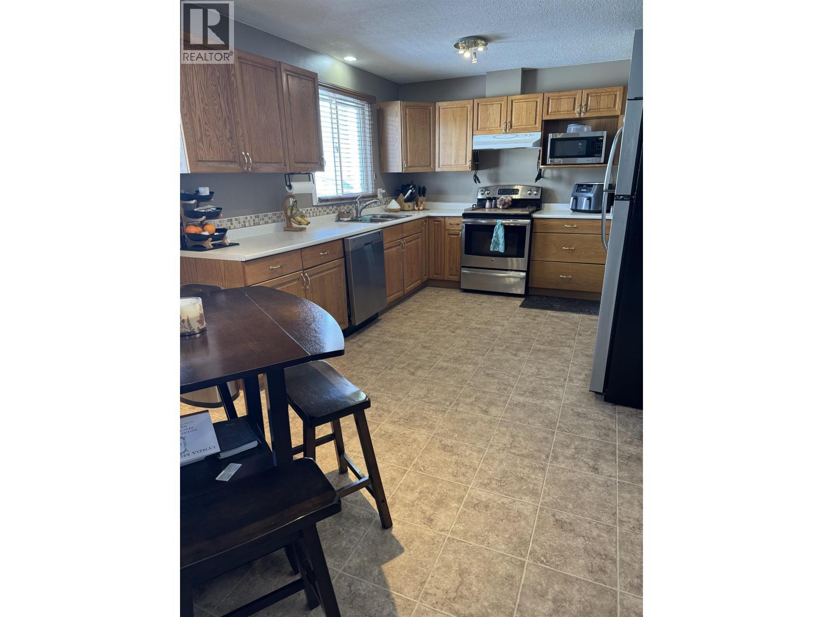 13 Manson Crescent, Mackenzie, BC - Indoor Photo Showing Kitchen With Double Sink