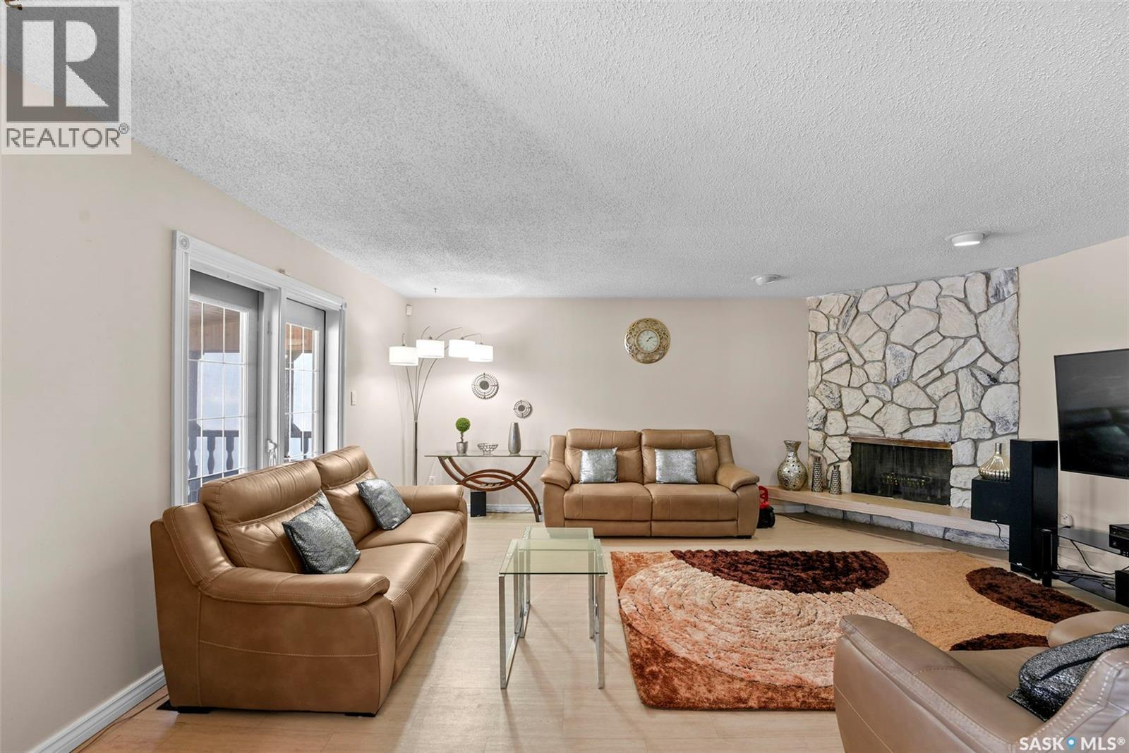 55 Noonan Road, Regina, SK - Indoor Photo Showing Living Room With Fireplace