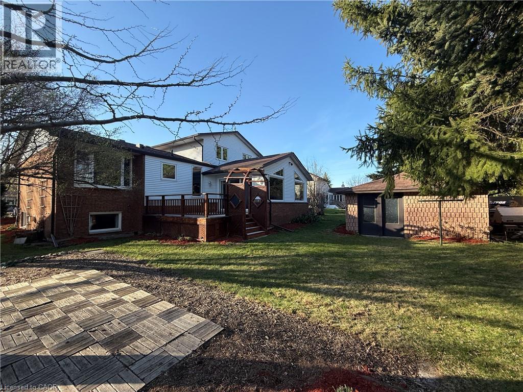 View of yard with a wooden deck - 567 Rustic Drive, Waterloo, ON - Outdoor