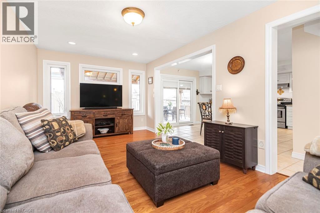 Living area with light wood-style floors and recessed lighting - 40 Artistic Boulevard, Hamilton, ON - Indoor Photo Showing Living Room