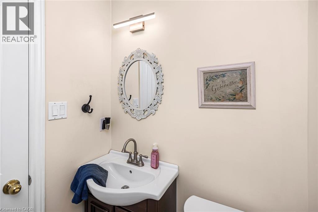 Half bathroom with vanity and toilet - 40 Artistic Boulevard, Hamilton, ON - Indoor Photo Showing Bathroom