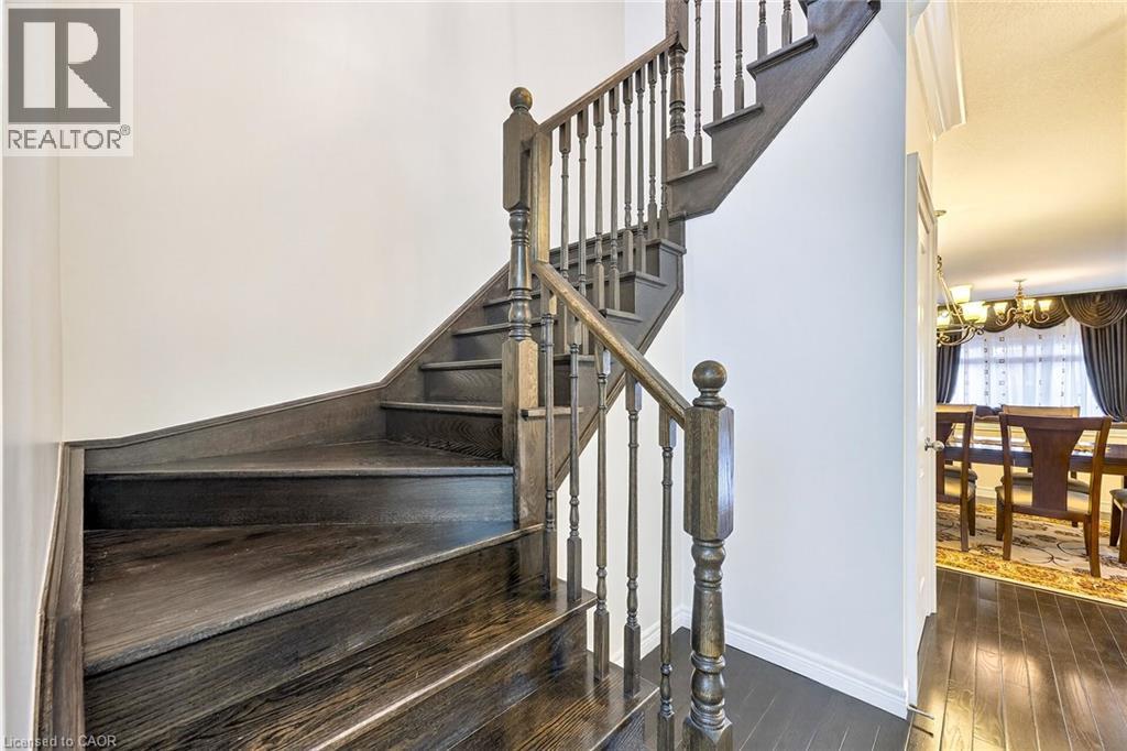 Staircase with hardwood - 182 Irwin Avenue, Hamilton, ON - Indoor Photo Showing Other Room