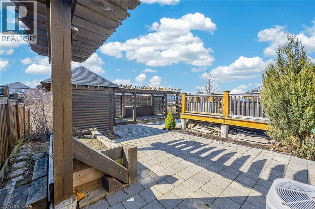 Fenced backyard with a patio area and a pergola - 182 Irwin Avenue, Hamilton, ON - Outdoor With Deck Patio Veranda