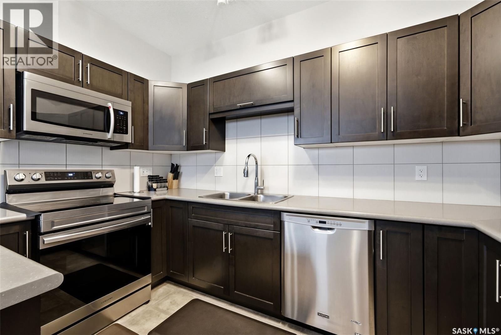 4609 Green Rock Road E, Regina, SK - Indoor Photo Showing Kitchen With Stainless Steel Kitchen With Double Sink
