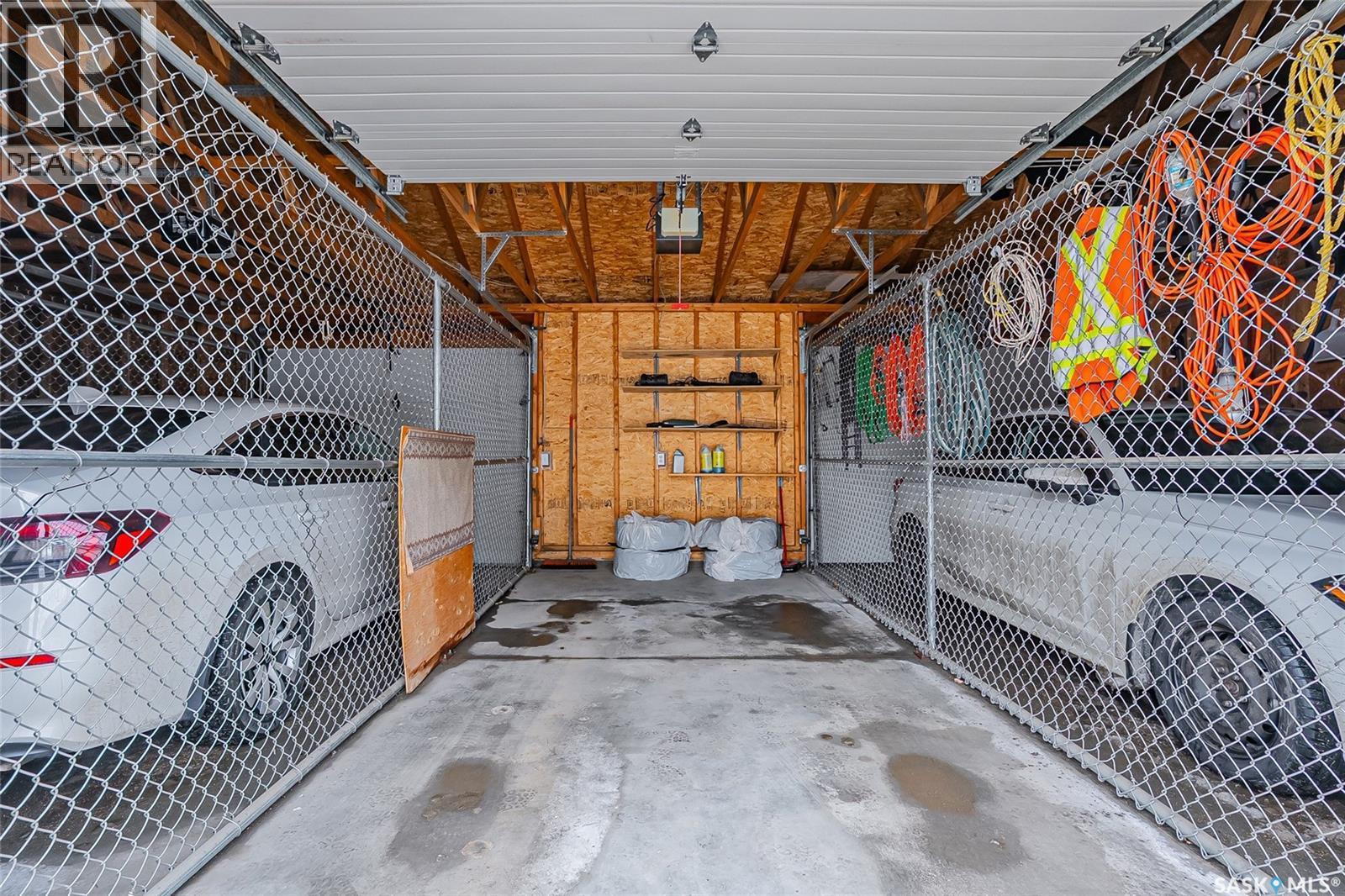 102A 425 Keevil Crescent, Saskatoon, SK - Indoor Photo Showing Garage
