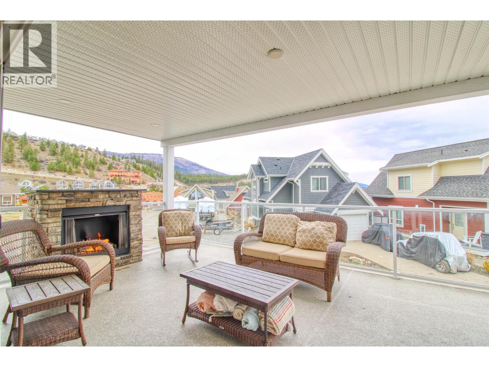 6746 Marbella Loop Unit# 304, Kelowna, BC - Outdoor With Fireplace With Deck Patio Veranda With Exterior