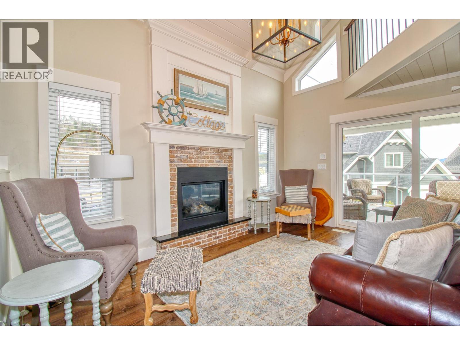 6746 Marbella Loop Unit# 304, Kelowna, BC - Indoor Photo Showing Living Room With Fireplace
