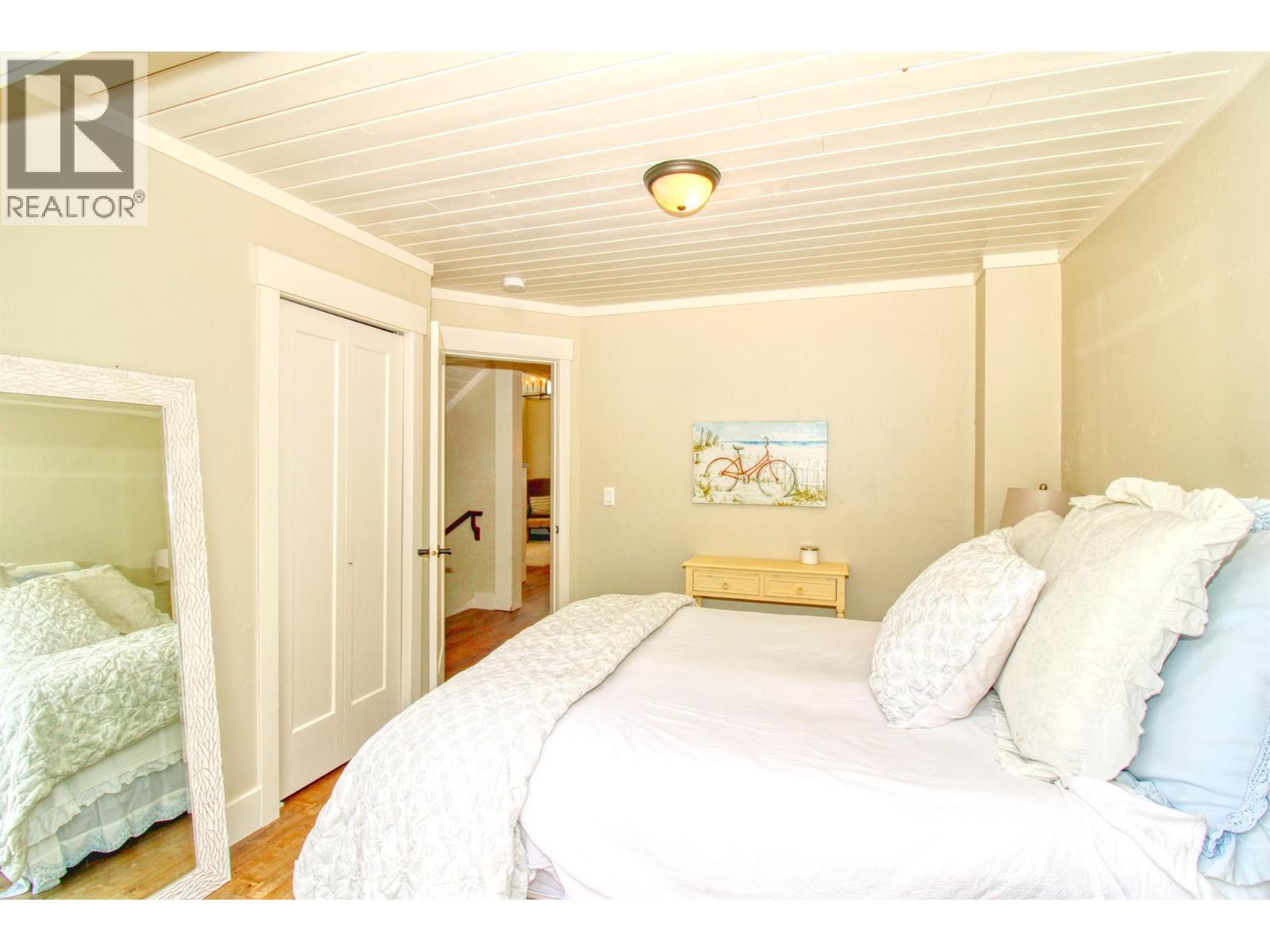 Main floor bed 1 - 6746 Marbella Loop Unit# 304, Kelowna, BC - Indoor Photo Showing Bedroom