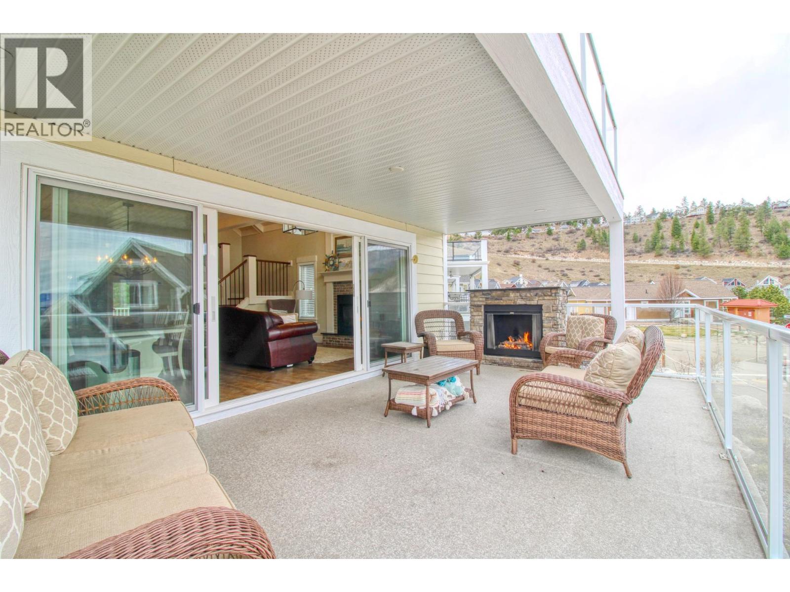 6746 Marbella Loop Unit# 304, Kelowna, BC - Outdoor With Fireplace With Deck Patio Veranda With Exterior