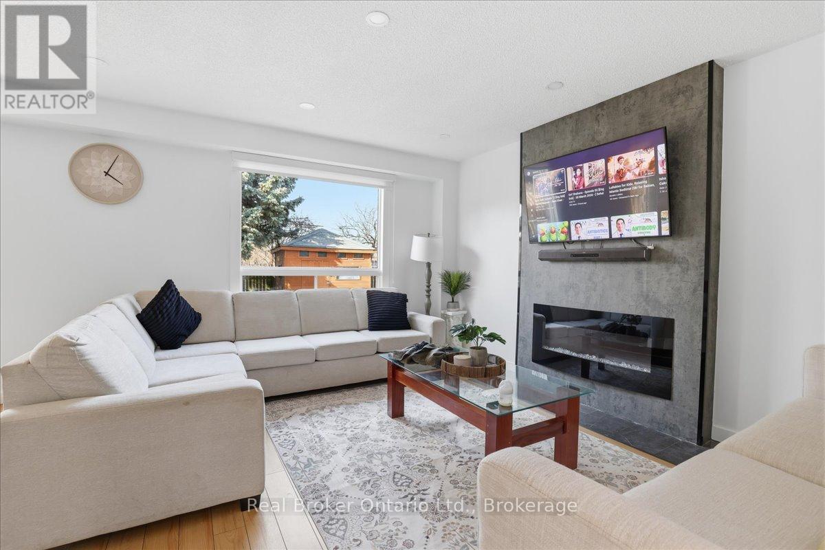 9 Holm Street, Cambridge, ON - Indoor Photo Showing Living Room With Fireplace