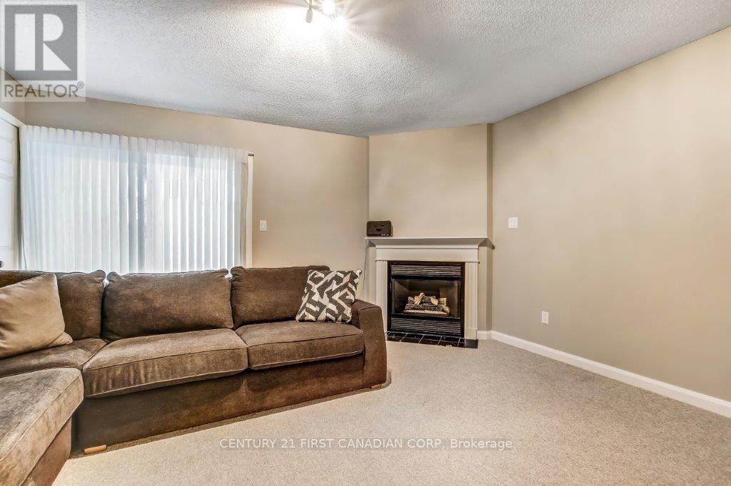 Gas fireplace in walk out family room - 2 - 609 Colborne Street, London East (East F), ON - Indoor Photo Showing Living Room With Fireplace