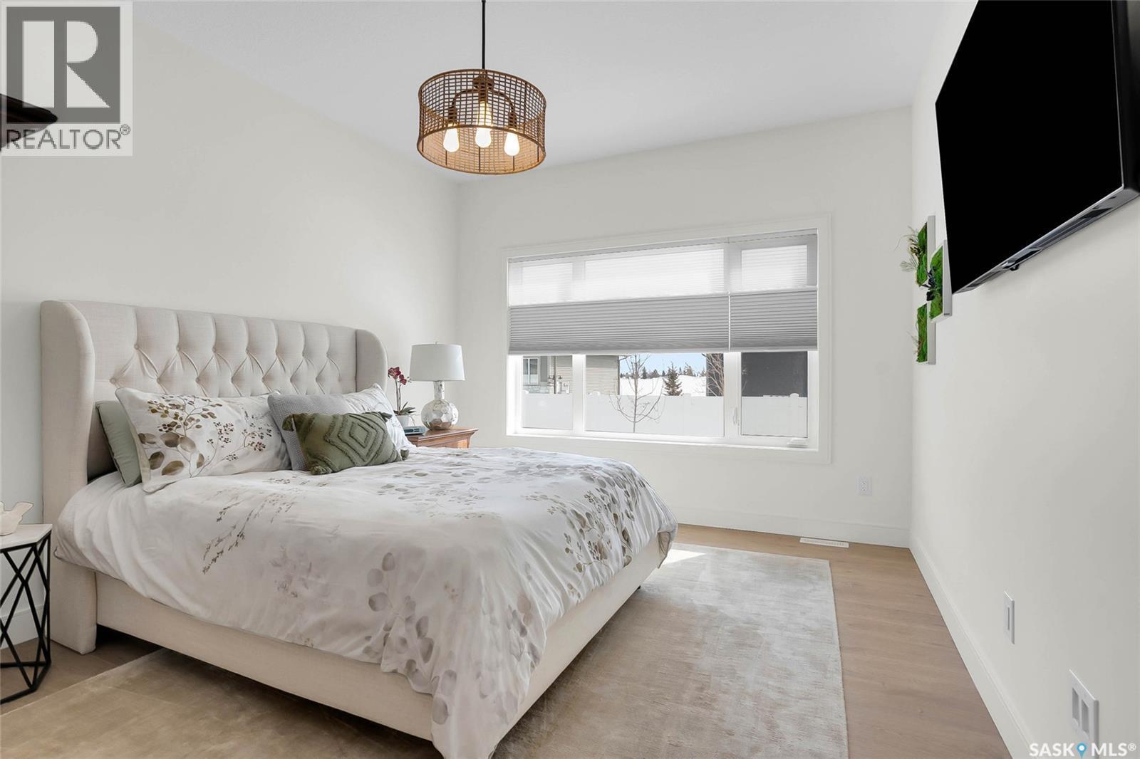 9 437 Palmer Crescent, Warman, SK - Indoor Photo Showing Bedroom