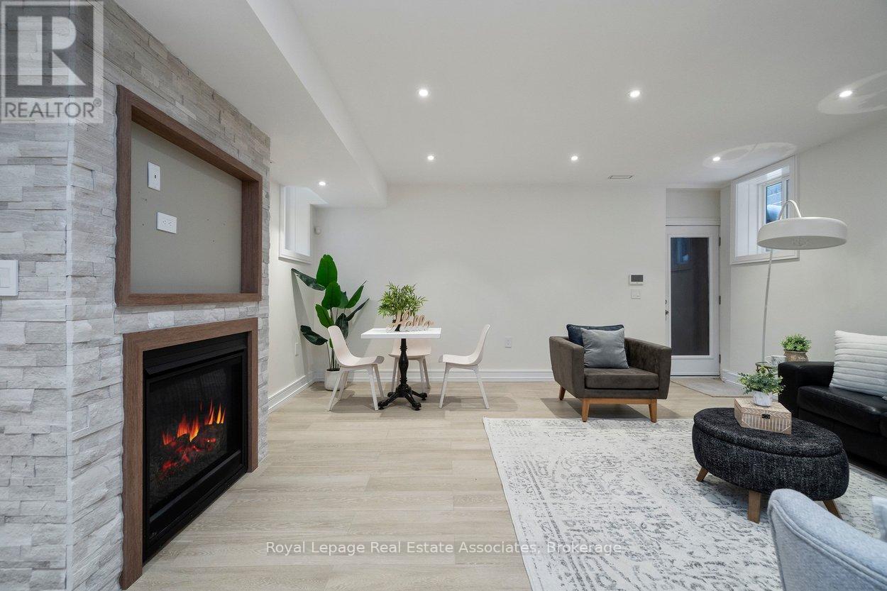 Family Room - 63 Troy Street, Mississauga, ON - Indoor Photo Showing Living Room With Fireplace