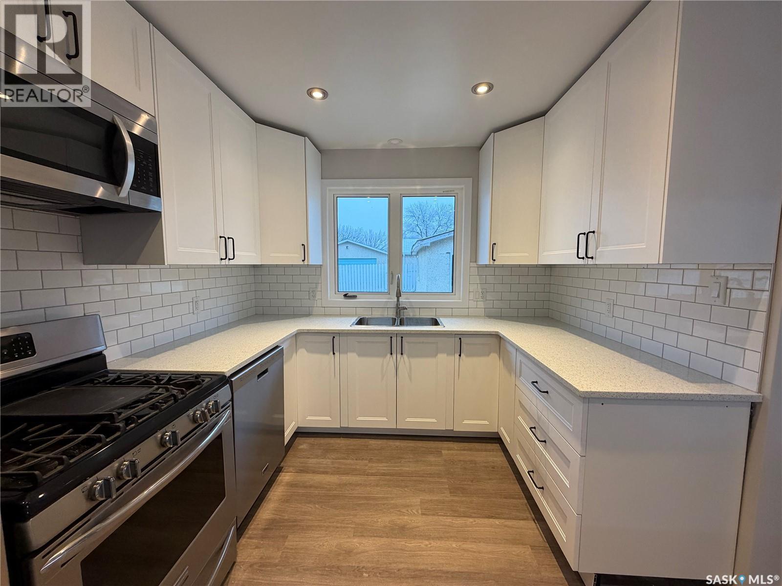 60 Ritchie Crescent, Regina, SK - Indoor Photo Showing Kitchen With Double Sink