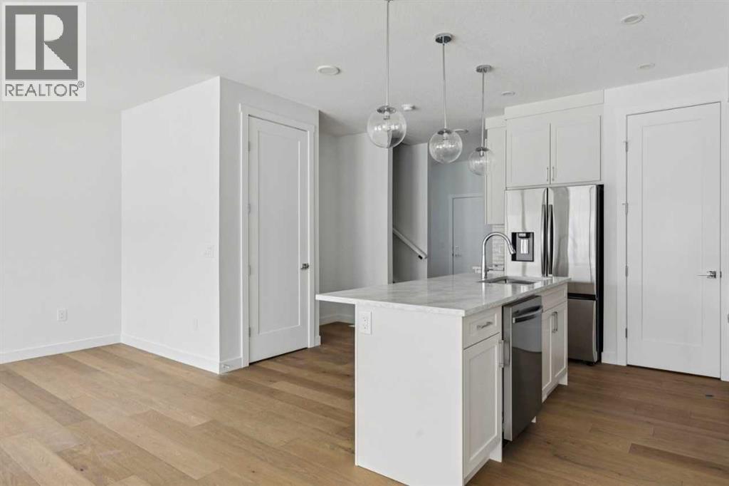 25 Linden Place, Rural Red Deer County, AB - Indoor Photo Showing Kitchen With Upgraded Kitchen