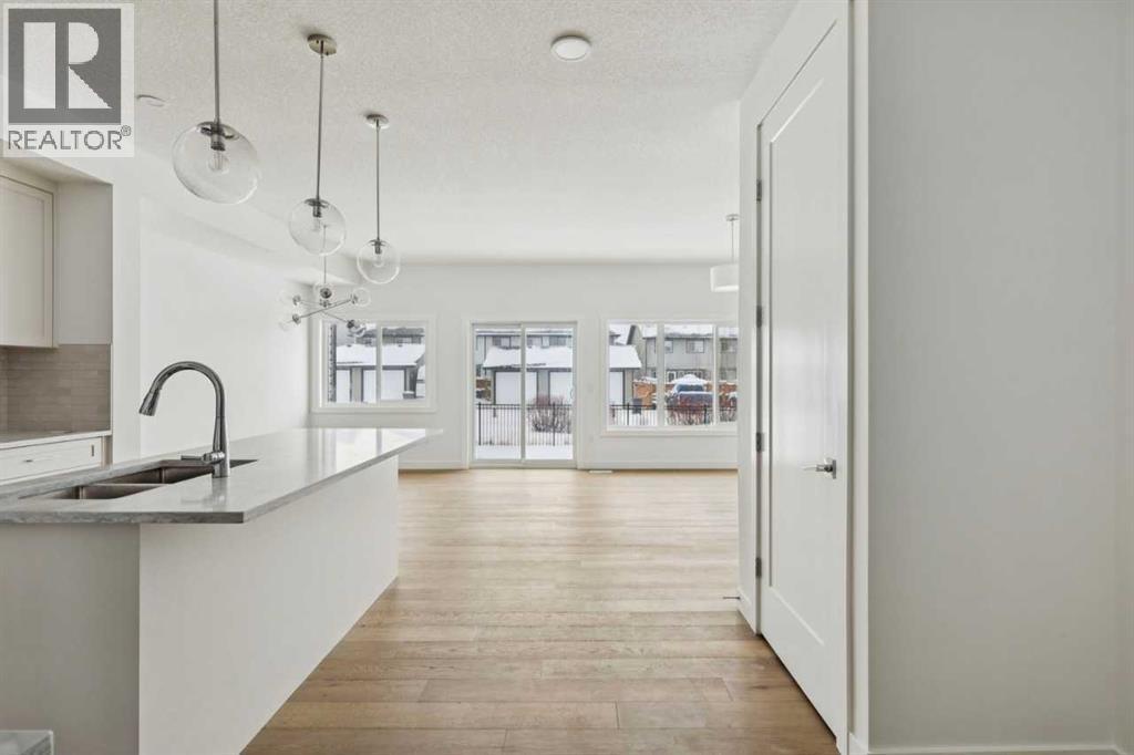 25 Linden Place, Rural Red Deer County, AB - Indoor Photo Showing Kitchen With Double Sink