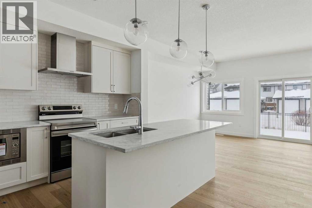 25 Linden Place, Rural Red Deer County, AB - Indoor Photo Showing Kitchen With Upgraded Kitchen