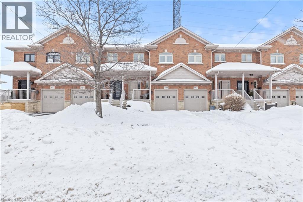Traditional-style house with covered porch and brick siding - 1069 Beach Boulevard, Hamilton, ON - Outdoor With Facade