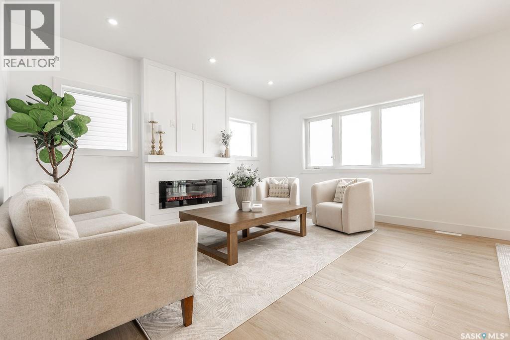 307 Sharma Crescent, Saskatoon, SK - Indoor Photo Showing Living Room With Fireplace