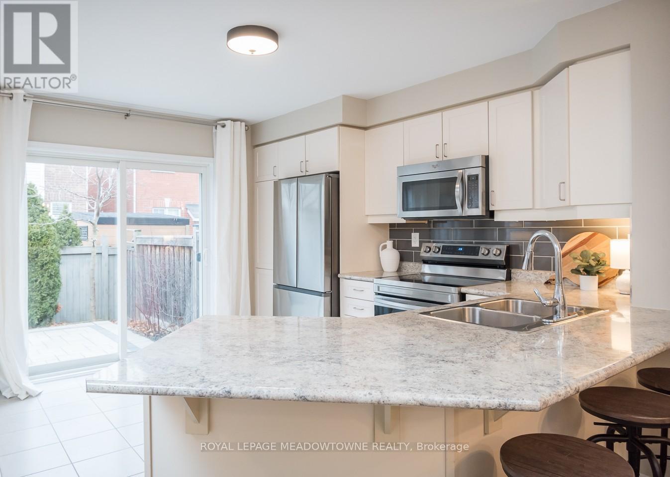 1667 Clitherow Street, Milton, ON - Indoor Photo Showing Kitchen With Stainless Steel Kitchen With Double Sink With Upgraded Kitchen