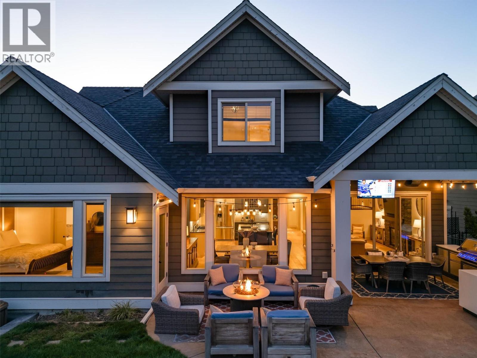 Built-in BBQ, beverage fridge & outdoor TV! - 425 Audubon Court, Kelowna, BC - Outdoor With Deck Patio Veranda